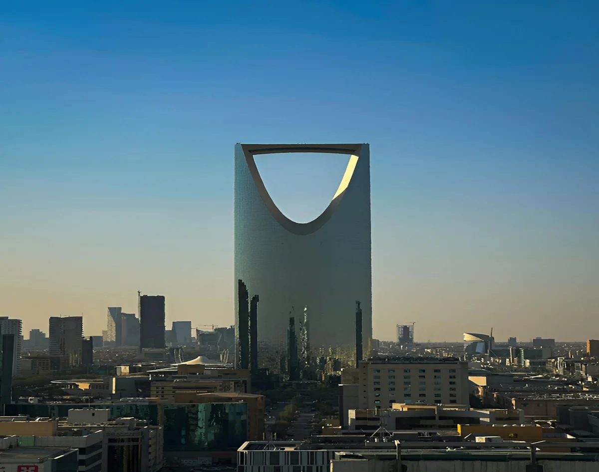 Kingdom Centre and the Riyadh skyline against a clear blue sky
